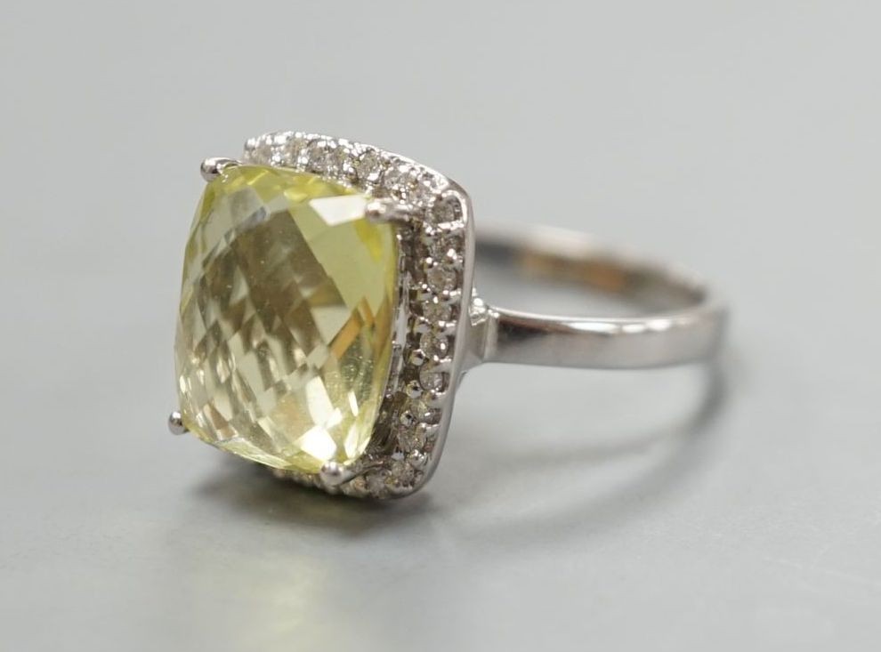A modern 18ct white gold, fancy cut citrine and diamond cluster set dress ring, size M, gross weight 4.3 grams.